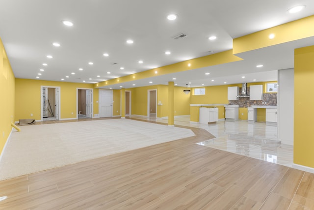31460 James St, Garden City, MI 48135 - unfurnished living room with baseboards, light wood-style floors, and recessed lighting
