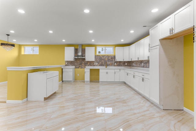 31460 James St, Garden City, MI 48135 - kitchen featuring wall chimney exhaust hood, decorative backsplash, white cabinets, recessed lighting, and baseboards
