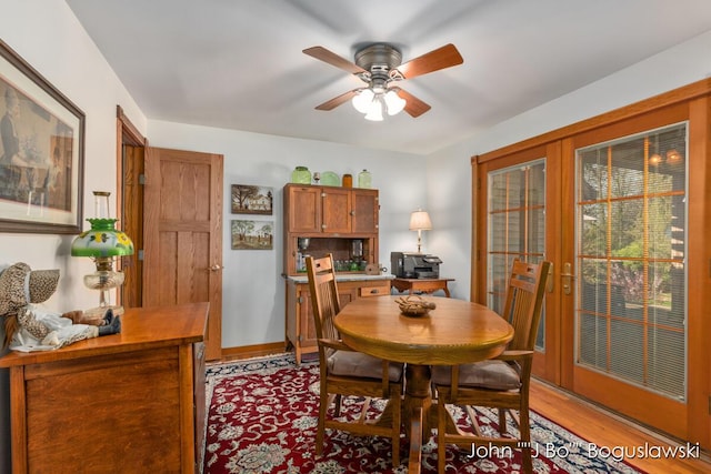 1017 Pearl St, Belding, MI 48809 - dining area with light wood finished floors, french doors, and ceiling fan