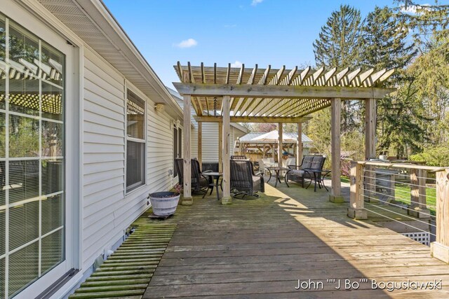 1017 Pearl St, Belding, MI 48809 - wooden deck with a pergola