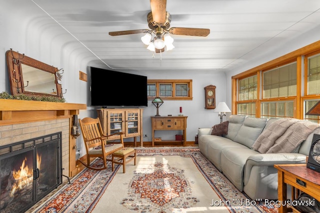 1017 Pearl St, Belding, MI 48809 - living area with a ceiling fan and a brick fireplace