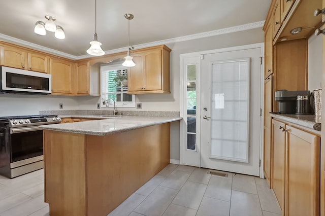 1699 Brentwood Dr, Wixom, MI 48393 - kitchen with stainless steel range with gas cooktop, white microwave, a sink, a peninsula, and decorative light fixtures