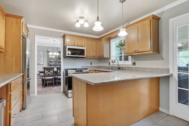 1699 Brentwood Dr, Wixom, MI 48393 - kitchen with stainless steel appliances, a sink, light tile patterned flooring, a peninsula, and healthy amount of natural light
