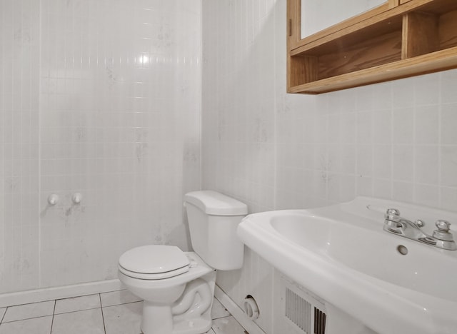 1699 Brentwood Dr, Wixom, MI 48393 - half bathroom with a sink, toilet, and tile patterned flooring