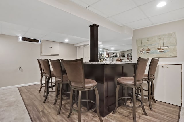 1699 Brentwood Dr, Wixom, MI 48393 - indoor bar featuring a drop ceiling, light wood-style flooring, and recessed lighting