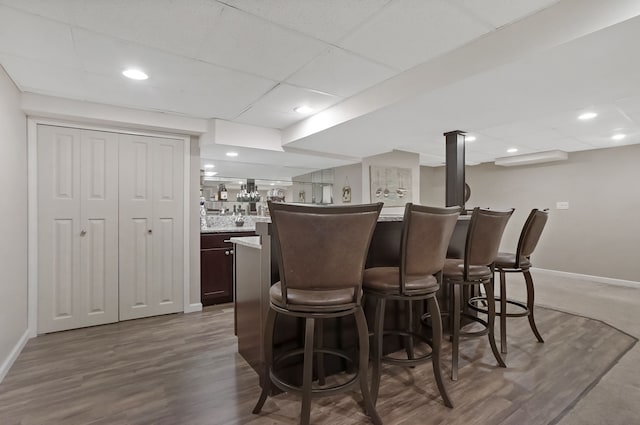 1699 Brentwood Dr, Wixom, MI 48393 - indoor bar with baseboards, dark wood-style flooring, and recessed lighting