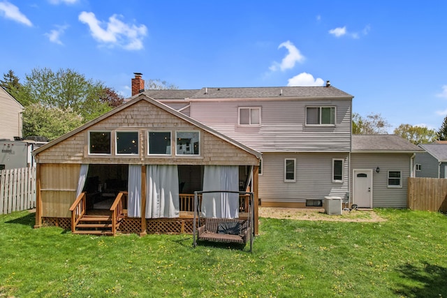 1699 Brentwood Dr, Wixom, MI 48393 - back of property featuring a chimney and central AC