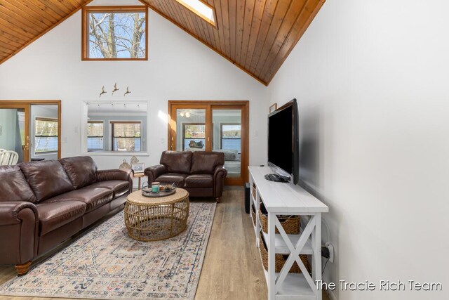 7964 W Royal Rd, Stanwood, MI 49346 - living room featuring light wood finished floors, high vaulted ceiling, healthy amount of natural light, and wood ceiling