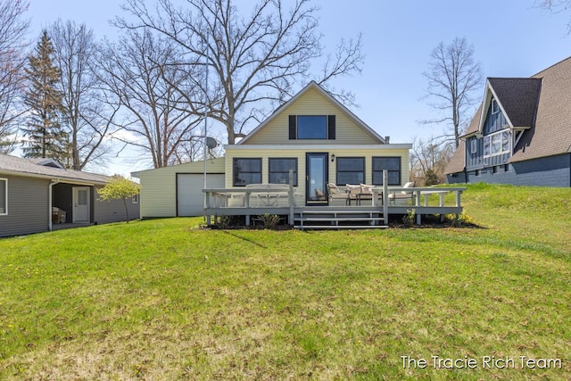 7964 W Royal Rd, Stanwood, MI 49346 - back of property with a deck, a lawn, and a garage