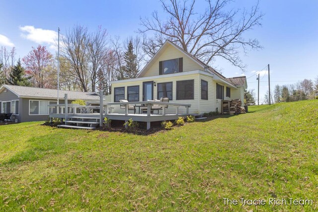 7964 W Royal Rd, Stanwood, MI 49346 - back of house featuring a deck and a lawn