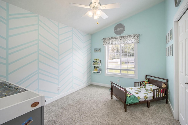 sitting room with carpet floors, lofted ceiling, baseboards, a ceiling fan, and wallpapered walls