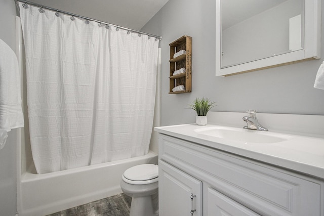 full bathroom featuring wood finished floors, toilet, shower / tub combo, and vanity