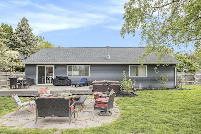 rear view of house featuring a hot tub, a deck, outdoor dining area, an outdoor fire pit, and roof with shingles