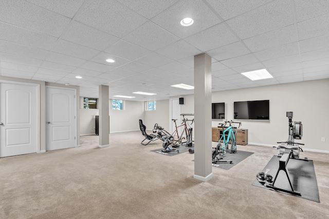 workout area featuring carpet floors, baseboards, a drop ceiling, and recessed lighting