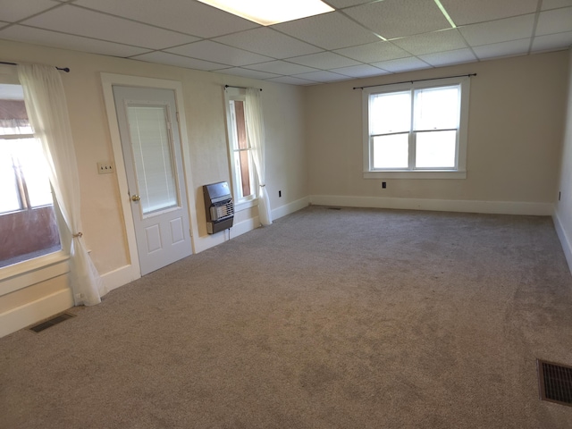 120 S Mackinaw St, Waldron, MI 49288 - empty room featuring heating unit, a paneled ceiling, baseboards, and carpet floors