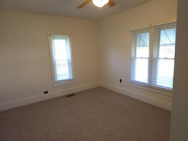 120 S Mackinaw St, Waldron, MI 49288 - carpeted spare room featuring a ceiling fan and baseboards