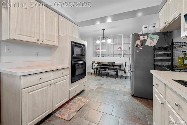 11233 Capri Dr, Warren, MI 48093 - kitchen with black appliances, light countertops, stone tile flooring, hanging light fixtures, and a chandelier
