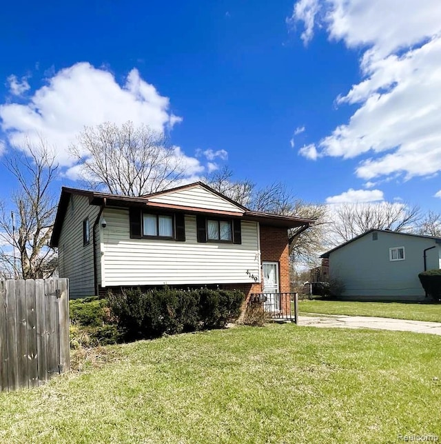 4149 Harriet St, Inkster, MI 48141 - view of front of home featuring brick siding and a front yard