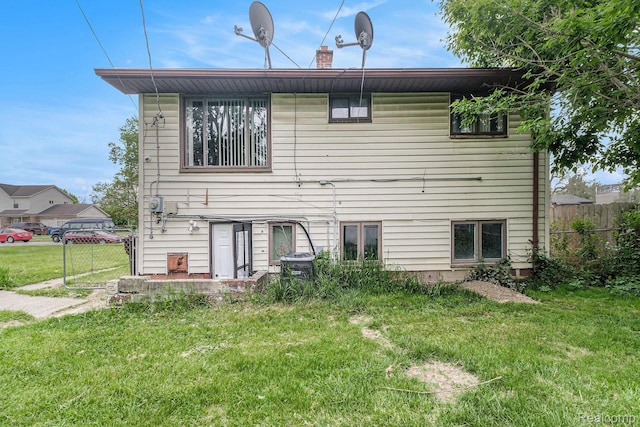 4149 Harriet St, Inkster, MI 48141 - back of property with central AC and a chimney