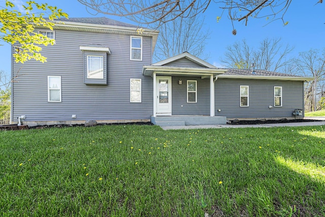 view of front of home featuring a porch and a front lawn