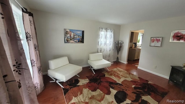 606 E Milton Ave, Hazel Park, MI 48030 - sitting room featuring dark wood finished floors and baseboards