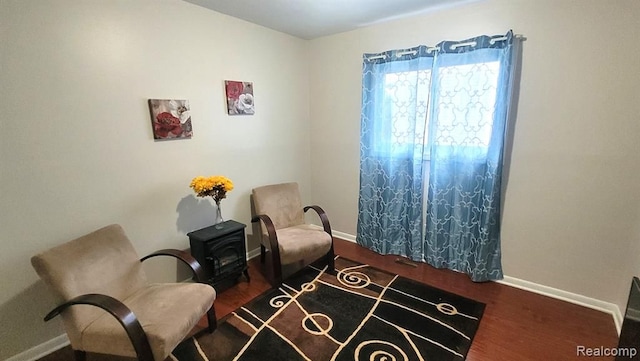 606 E Milton Ave, Hazel Park, MI 48030 - sitting room featuring baseboards and wood finished floors