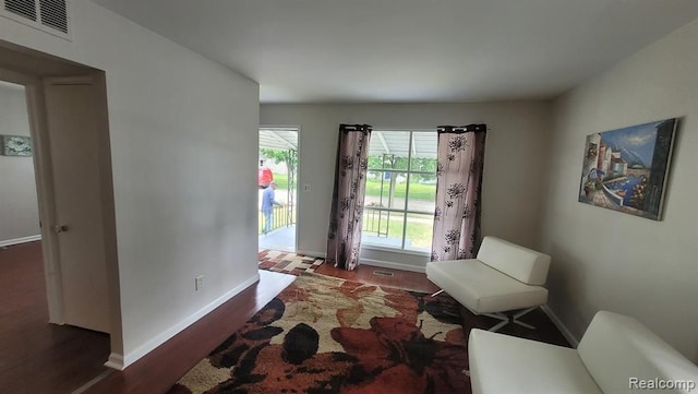606 E Milton Ave, Hazel Park, MI 48030 - entrance foyer with dark wood-style floors and baseboards