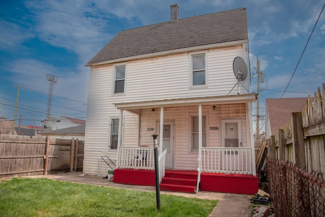 view of front of house with covered porch and roof with shingles