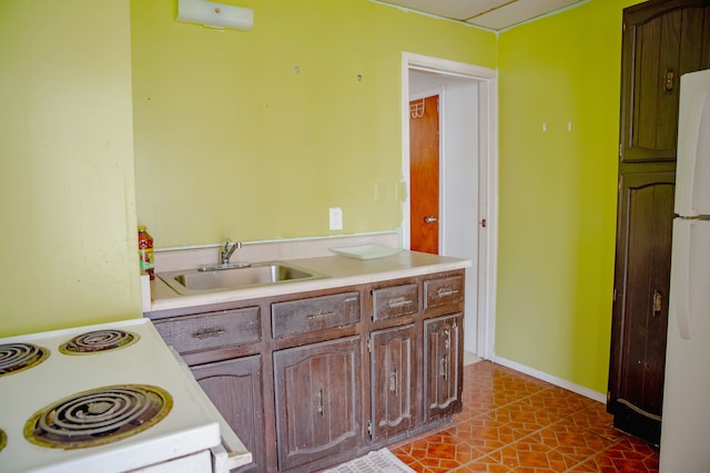 bathroom featuring a sink and tile patterned flooring