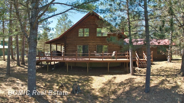 940 Wood River Rd, Grayling, MI 49738 - rear view of property featuring log siding and a deck