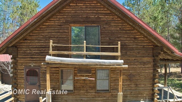 940 Wood River Rd, Grayling, MI 49738 - view of property exterior featuring log siding