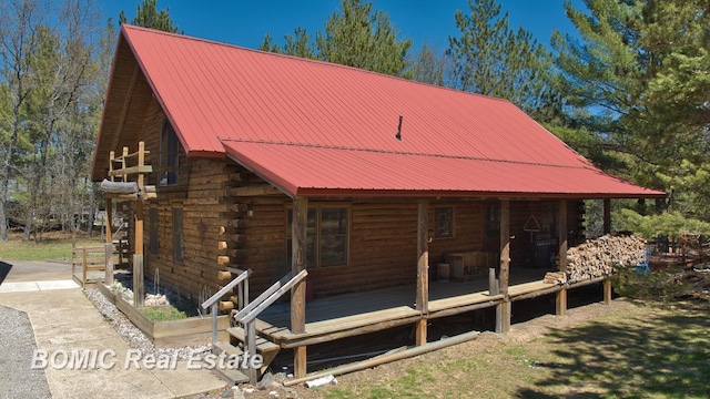 940 Wood River Rd, Grayling, MI 49738 - view of front facade featuring log exterior and metal roof