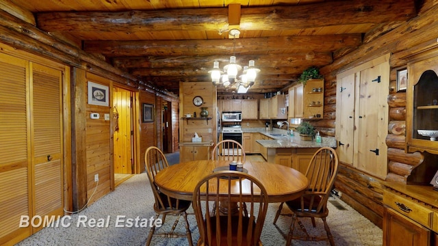 940 Wood River Rd, Grayling, MI 49738 - dining area with log walls, beam ceiling, a chandelier, carpet floors, and wood ceiling