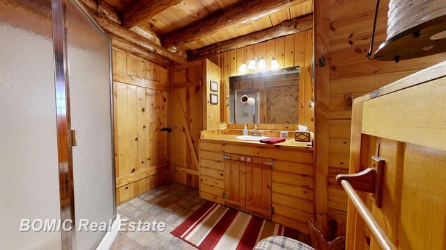 940 Wood River Rd, Grayling, MI 49738 - bathroom featuring wooden walls, wood ceiling, beam ceiling, and vanity