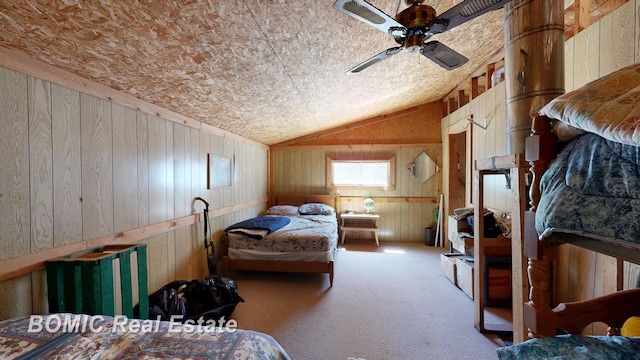 940 Wood River Rd, Grayling, MI 49738 - bedroom with wooden walls, vaulted ceiling, and carpet floors