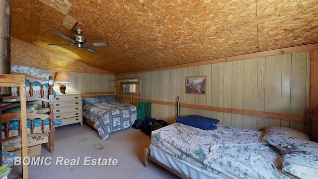 940 Wood River Rd, Grayling, MI 49738 - carpeted bedroom featuring lofted ceiling, wooden walls, and a wall unit AC