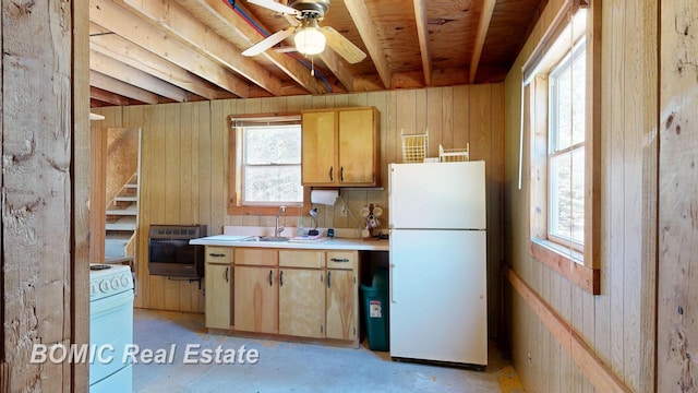 940 Wood River Rd, Grayling, MI 49738 - kitchen with white appliances, heating unit, a sink, ceiling fan, and light countertops