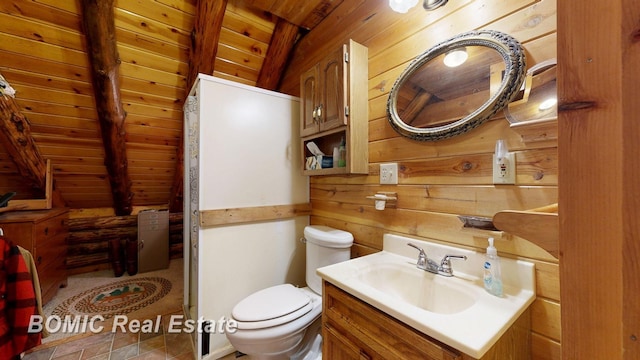 940 Wood River Rd, Grayling, MI 49738 - bathroom featuring wooden walls, wooden ceiling, toilet, vaulted ceiling, and vanity