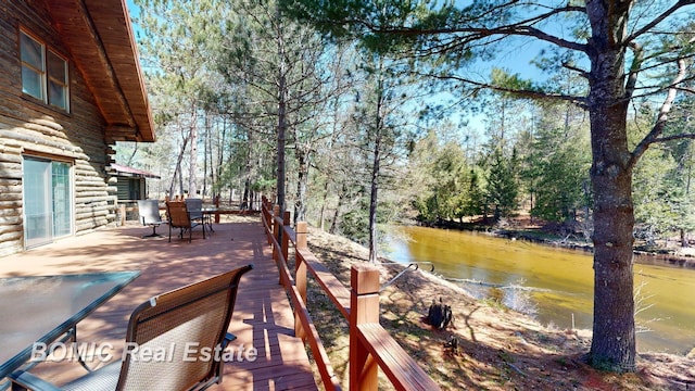 940 Wood River Rd, Grayling, MI 49738 - dock with a water view and outdoor dining space