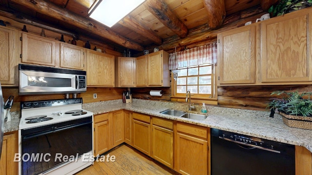 940 Wood River Rd, Grayling, MI 49738 - kitchen featuring stainless steel microwave, electric range oven, black dishwasher, a sink, and light wood-style floors