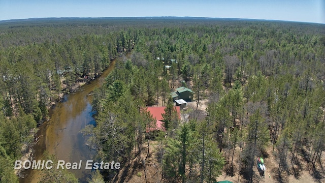 940 Wood River Rd, Grayling, MI 49738 - aerial overview of property's location featuring a heavily wooded area