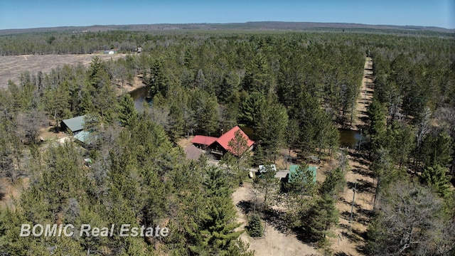 940 Wood River Rd, Grayling, MI 49738 - aerial view of property and surrounding area featuring a heavily wooded area