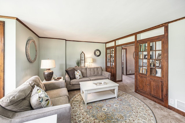 living area featuring light carpet, baseboards, french doors, and crown molding