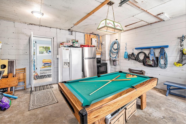 playroom with unfinished concrete floors and billiards table
