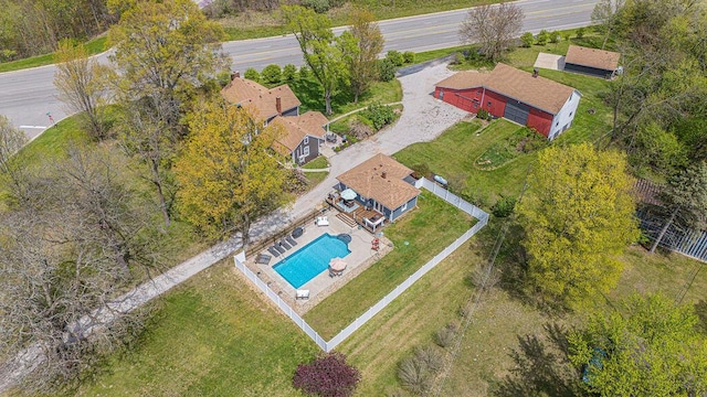 aerial view of property and surrounding area featuring a pool area