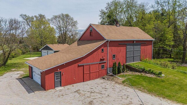 view of barn with a yard