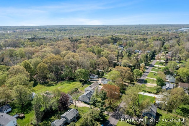 view of property location featuring a forest