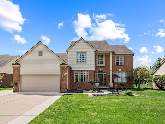 view of front of property with driveway, an attached garage, a front lawn, and brick siding