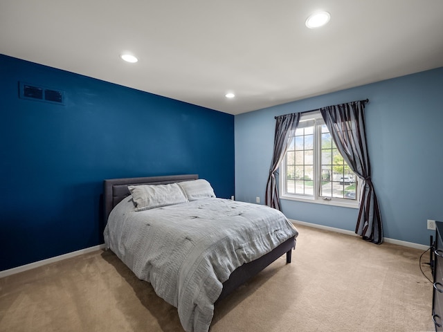 bedroom with light carpet, baseboards, and recessed lighting