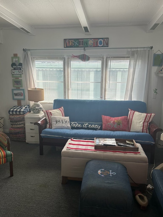 living area with beam ceiling and carpet floors